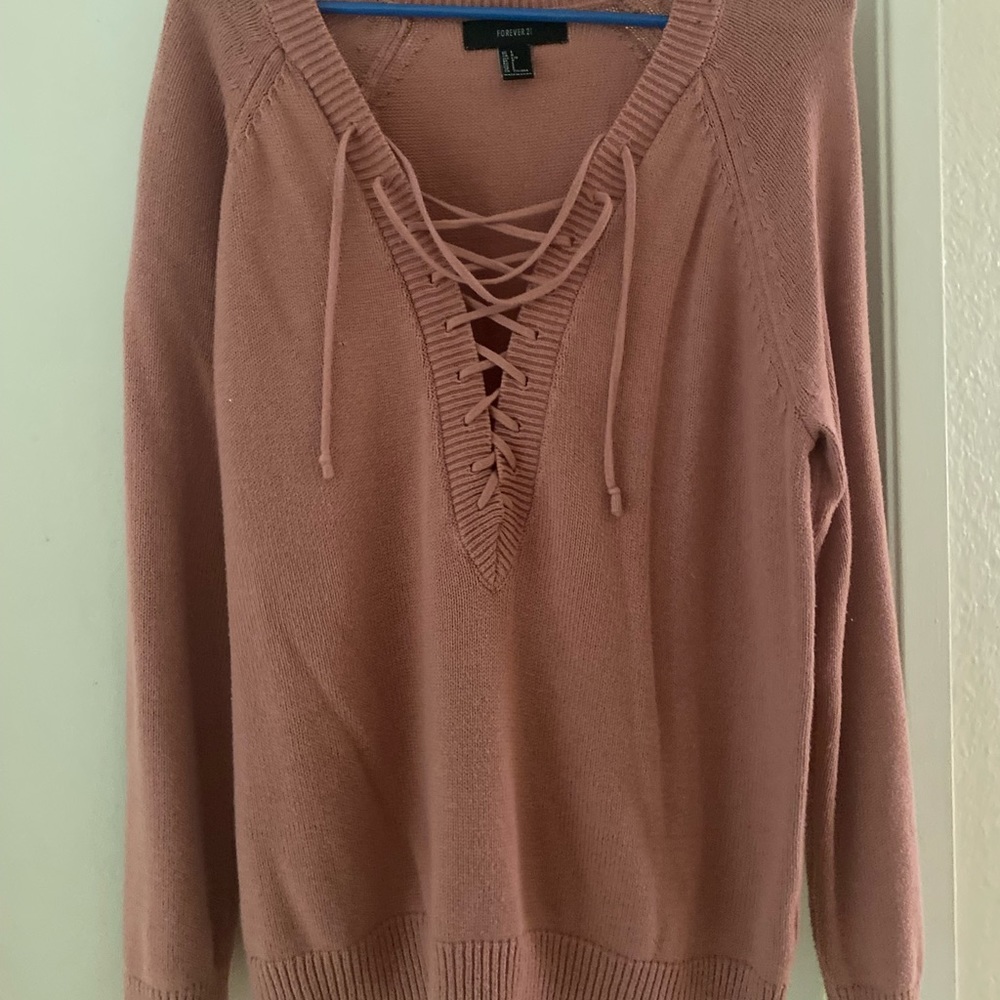 Mauve sweater with strings near chest area